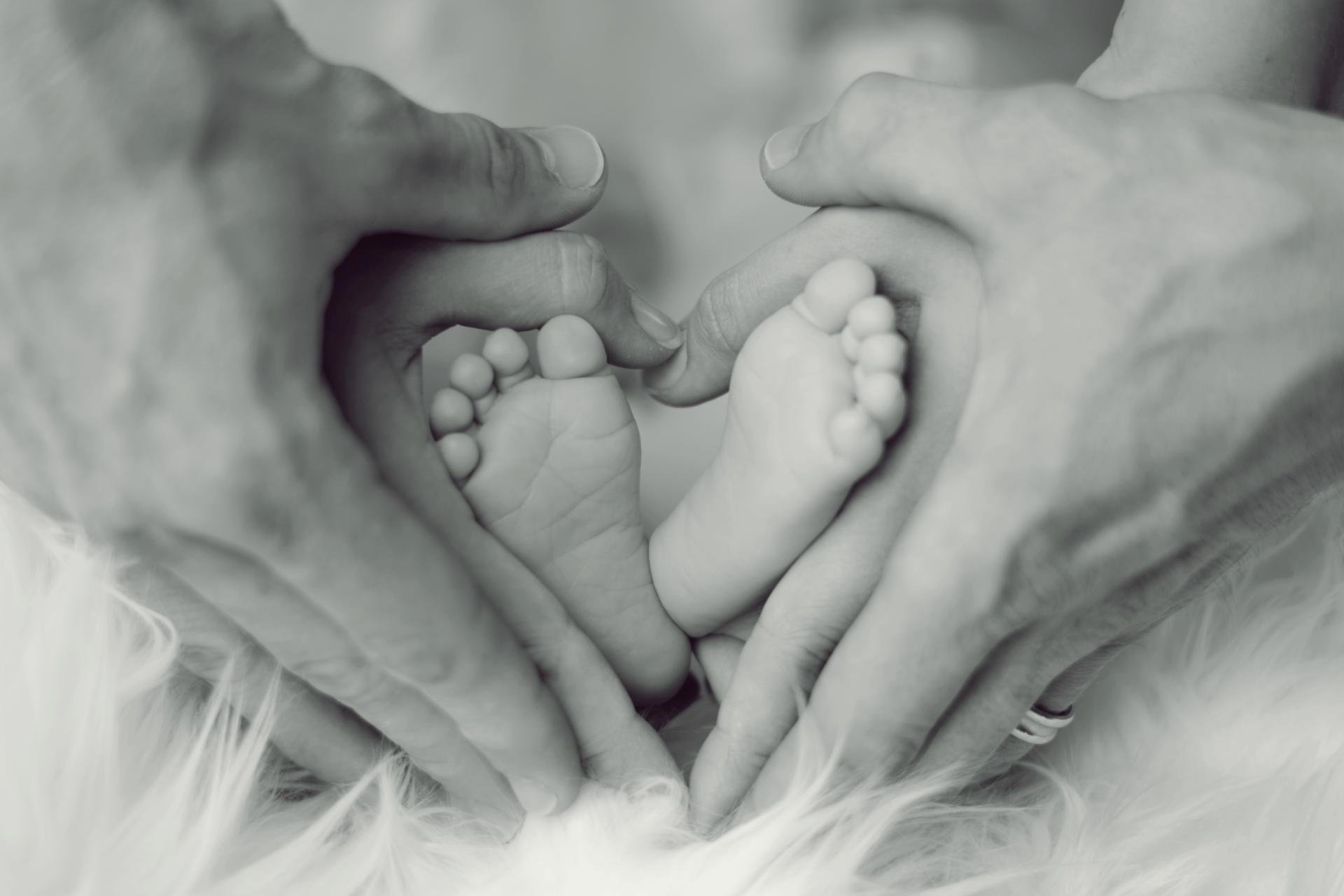 Baby feet and parents hands-foreign non-grantor trust